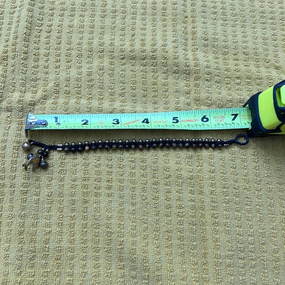 Brown and bronze colored beaded dolphin bracelet. - Picture 5 of 5